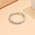 Detail of silver open ring with sparkling pavé crystals on textured geometric band - Silver