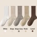 Five pairs of ribbed cotton mid-tube socks in white, beige, grey, khaki and camel - One Size