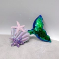 Detail of mermaid tail hair clip with green sequins, purple shell and glitter starfish - Green Mermaid