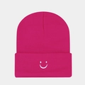 Detailed view of magenta knitted beanie featuring a white embroidered smile face - Rose Red