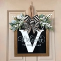 Letter V personalized wooden door hanger with white floral decor and striped bow - Letter V