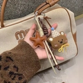 Ciondolo per telefono con stella in pelle marrone e orsetto di peluche, corda intrecciata - Stile Orsetto Marrone e Stella Caffè