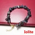 Detailed close-up of natural iolite chips bracelet with gold lobster clasp and chain - Iolite