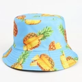 Close-up of vibrant pineapple print and reinforced stitching on blue bucket hat - M (56-58cm) / Blue