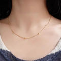 Minimalist 18k gold plated stainless steel beaded chain necklace worn by a model - Snake Chain with Beads / Gold