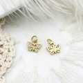 Detailed close-up of micro-pave gold butterfly charms with sparkling crystals - Dragonfly