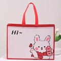 Cute white non-woven gift bag with red trim and a cartoon rabbit illustration - Rabbit