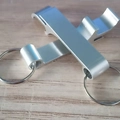 Creative silver metal beer bottle opener keychain with a sleek crossover layout - Silver (11g)