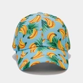 Close-up of tropical banana and palm leaf print on a light blue cotton baseball cap - Light Blue All-over Banana Style