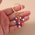 Fashionable keychain with gold metal ring and nautical lifebuoy charms in red and blue - Red Blue Lifebuoy