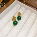 Detailed close-up of vintage gold knot earrings with polished deep green resin beads - Flower Resin Bead (Gold & Deep Green)