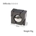 Casse-tête cube noir en métal avec sphère argentée et design en alliage pesant 92g - Boule Magique