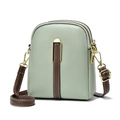 Sac bandoulière vert sauge avec finitions marron et fermetures éclair dorées élégantes - Vert
