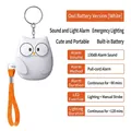 White owl-shaped personal security alarm with orange pull cord and 130dB sound system - Chinese Packaging / Owl / White