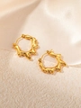 Detailed view of gold stainless steel earrings with irregular water ripple texture on silk - Lava Teardrop Style / Gold