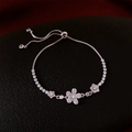 Detail of zircon flower bracelet with adjustable slider clasp on black texture background - Flower / Silver