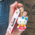 3D Hello Kitty keychain featuring a red dress, blue bow, and matching wrist strap with gold hook - Hello Kitty-Pink & Yellow Heart Dress