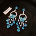 Orecchini a farfalla in cristallo azzurro con nappe a goccia d'acqua in argento - Perno in argento-Blu