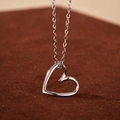 Elegant 925 sterling silver hollow heart pendant necklace with shiny silver finish - 925 Silver / White Gold