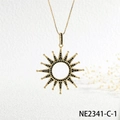 Macro view of gold sun pendant necklace featuring pave set black cubic zirconia stones - Gold Black Zircon Sun