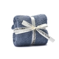 Blue-grey coral fleece towel folded into a square with decorative ribbon for gifts - Blue
