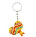 Detailopname van een kleurrijke PVC muziek sleutelhanger met feestelijke gele maracas - Maracas Stijl