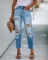 Details van lichtblauwe skinny jeans met gescheurde knieën en rafelige zoomranden - S / Lichtblauw