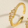 Macro detail of gold-plated adjustable ring featuring marquise and round zircon stones - Adjustable Open / Rectangular White Zirconia
