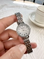 Detailed shot of silver ladies watch with rhinestone bezel and mother of pearl dial - Silver White Face