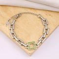 Macro shot of silver stainless steel bracelet featuring a green zircon square pendant - Silver Style (YS419 Steel Color-Green Rhinestone)