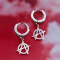 Macro shot of silver anarchy symbol earrings with punk rock style and polished finish - Anarchy Symbol
