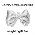Ciondolo a fiocco in acciaio inox argento per gioielli fai da te, misura 3,5x2,5 cm - Grande Fiocco Bordo Largo-TP0518 / Argento