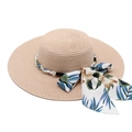 Detail of woven straw hat with pearl strap and tropical floral print silk bow decoration - M (56-58cm) / Pink