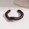 Close-up of brown wavy irregular acrylic open bangle with minimalist matte resin finish - 5# Wavy Irregular Open (Dark Brown)