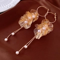 Detailed macro of gold-tone floral earrings with pearl tassels on brown silk background - Hollow Flower Pearl Tassel (12#)