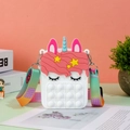 Close-up of unicorn silicone bag showing pop-it bubbles and rainbow strap detail - White