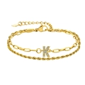 Bracelet doré à deux couches avec chaîne torsadée, maillons trombone et initiale K sertie - Lettre K