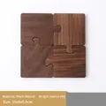 Set of 4 puzzle-shaped dark walnut wood coasters with natural grain and minimalist design - Black Walnut / Puzzle / Set of 4