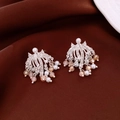 Detail of silver fan-shaped tassel earrings with pearls and crystals on velvet - French Fireworks Fan Tassel Ear Clip / Silver-Pink
