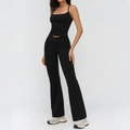 Black yoga set with strappy sports bra and V-cross high waist flared pants for women - S / Top And Bottom / Premium Black