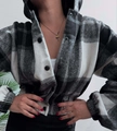 Detail of the hooded plaid shirt jacket featuring black and white checkered wool patterns - S / Black