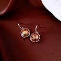 Close-up of champagne square zircon earrings with gold hooks on silk fabric - Ear Hook - Chocolate Gold - Coffee