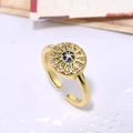 Anello regolabile in oro con design a raggiera geometrica e zircone blu centrale - Stile Stella Pietra Blu
