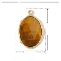 Dettaglio pendente in pietra naturale dimensioni 18mm per 12mm in acciaio dorato - Occhio di Tigre Ovale
