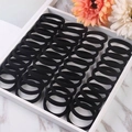 Set of black high-elastic seamless hair ties displayed neatly in a stylish white tray - 4cm Diameter / Black