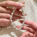 Elegant beaded pearl bracelet with pavé rhinestone sphere accents for a sophisticated look - Pink Medium Bead Style / 6mm Bead Diameter