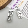 Antique silver alloy spider moon pendant featuring a heart embossed locket design - Antique Silver Vintage Flip Phone Charm