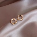 Macro shot of gold twisted double hoop earrings with pavé rhinestones on silk - A1587 Gold Rhinestone Double Layer