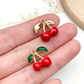 DIY jewelry charm featuring two red cherries with gold leaves for necklaces and earrings - KC Gold Red Enamel Fruit 3D Double Cherry (23401)