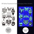 Glow-in-the-dark BY-002 tattoo sticker with butterfly and skull patterns in UV blue light - Fluorescent BY-002